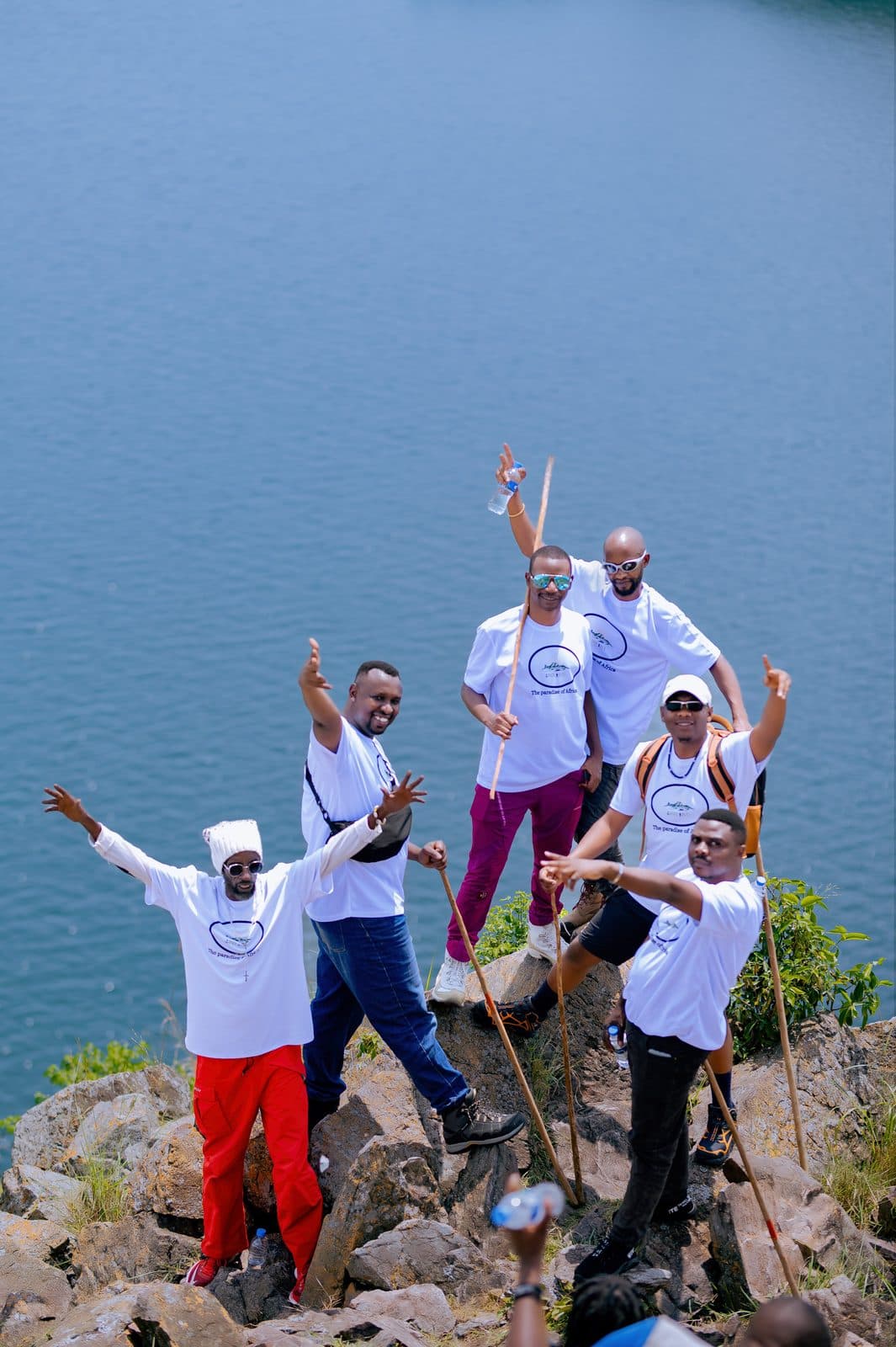 A group of visitors and hosts celebrating together after a tour