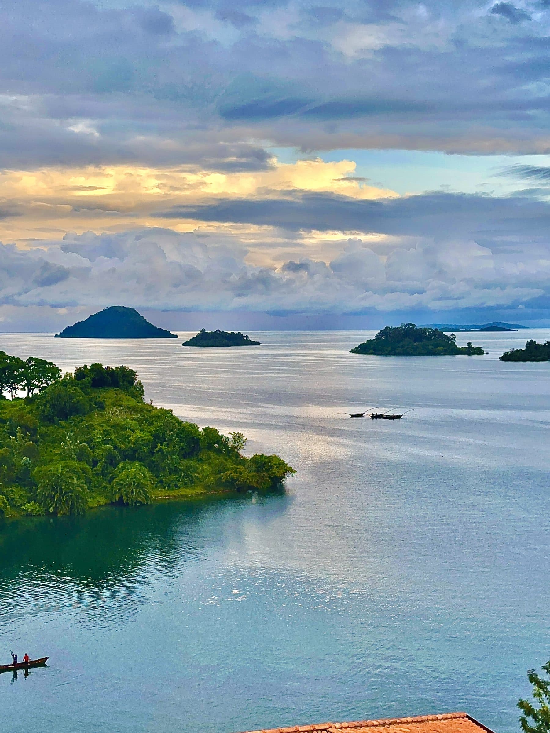 Evening light over the wooded islands and shoreline of Lake Kivu